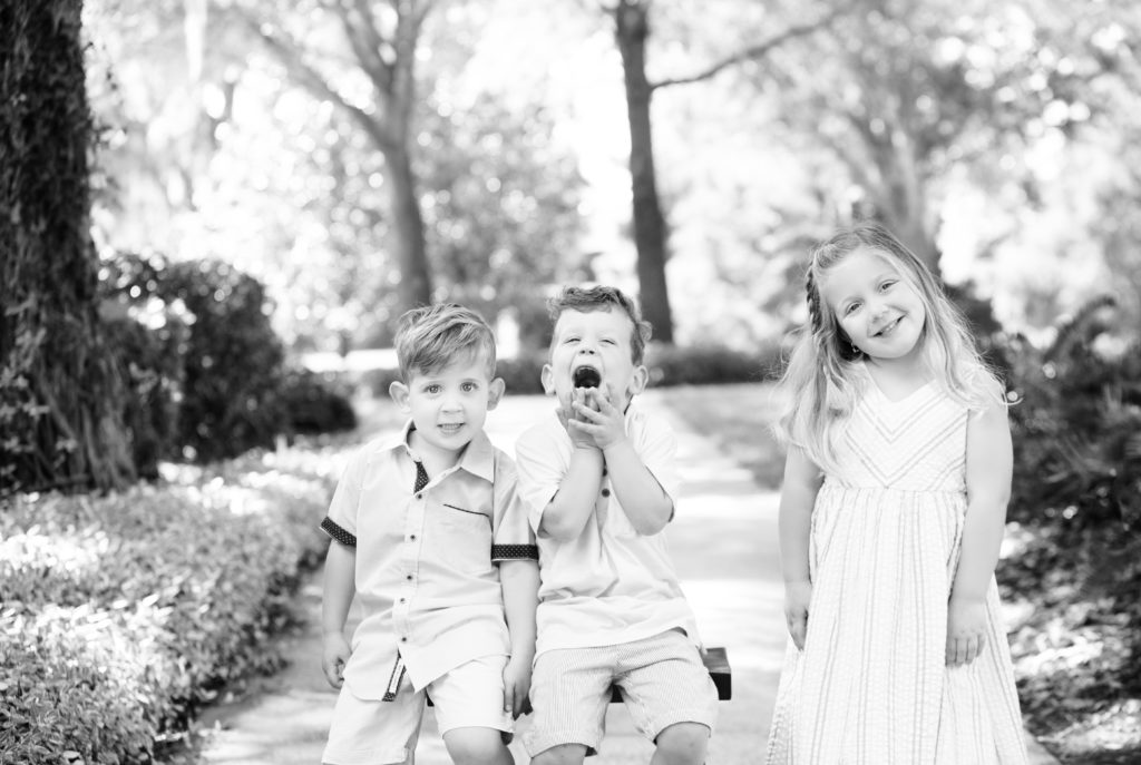 siblings being silly and smiling at camera at mini playdate