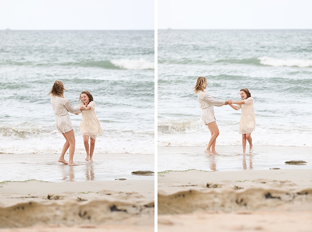 mom and daughter dancing on the beach during their sweet family beach session