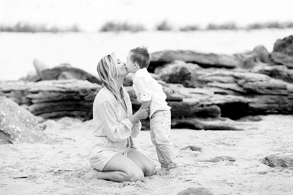 mom and son kissing during their  sweet family beach session