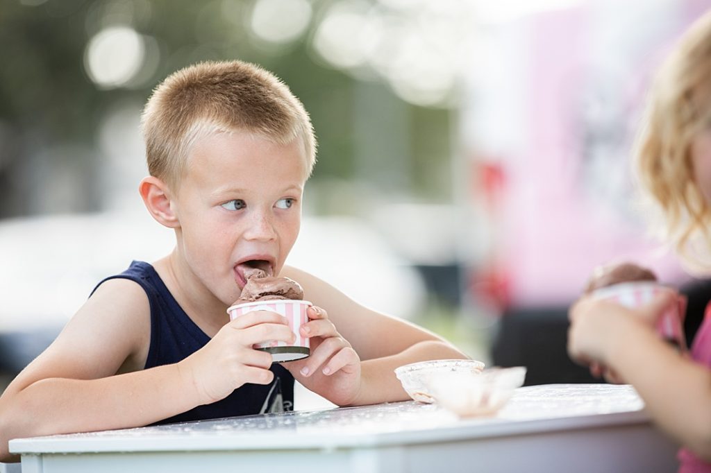 boy licking ice cream at summer session