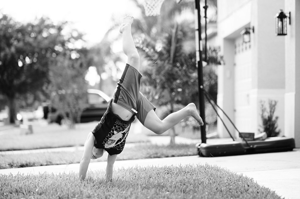 boy doing cartwheel at summer session