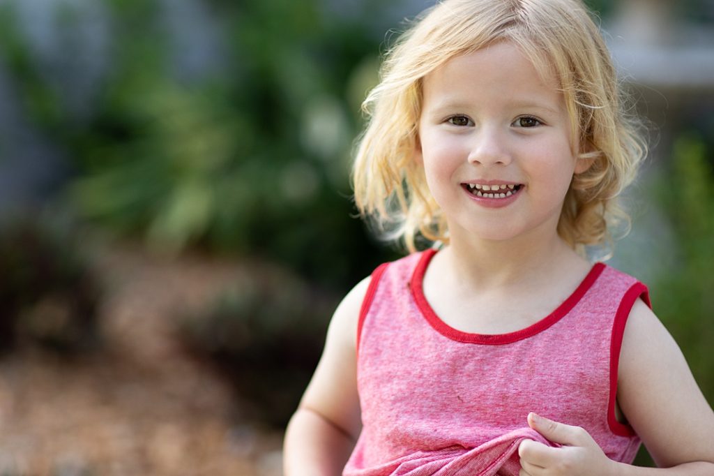 little girl smiling at summer session